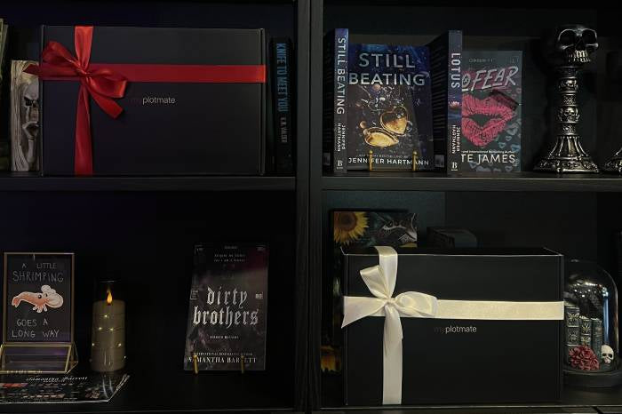 A close-up lifestyle shot of a woman's face partially obscured by the pages of an open dark romance book, with warm sunlight and soft focus.