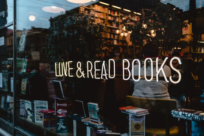 Dark romance bookshop storefront with the writing Love and Read Books.