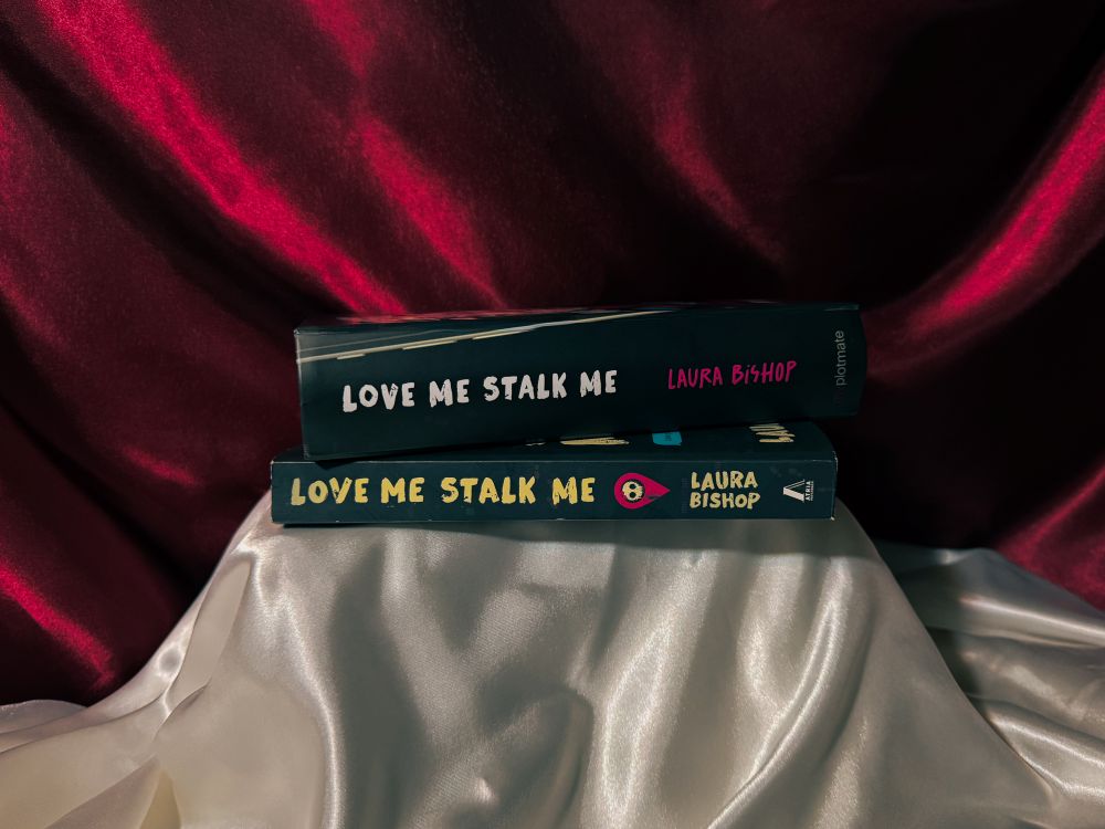 The Callahan book box next to the dark romance book Love Me Stalk Me by Laura Bishop.