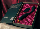 An opened book box presenting Callahan with its remote, the official adult toy from the dark romance book Love Me Stalk Me by Laura Bishop.