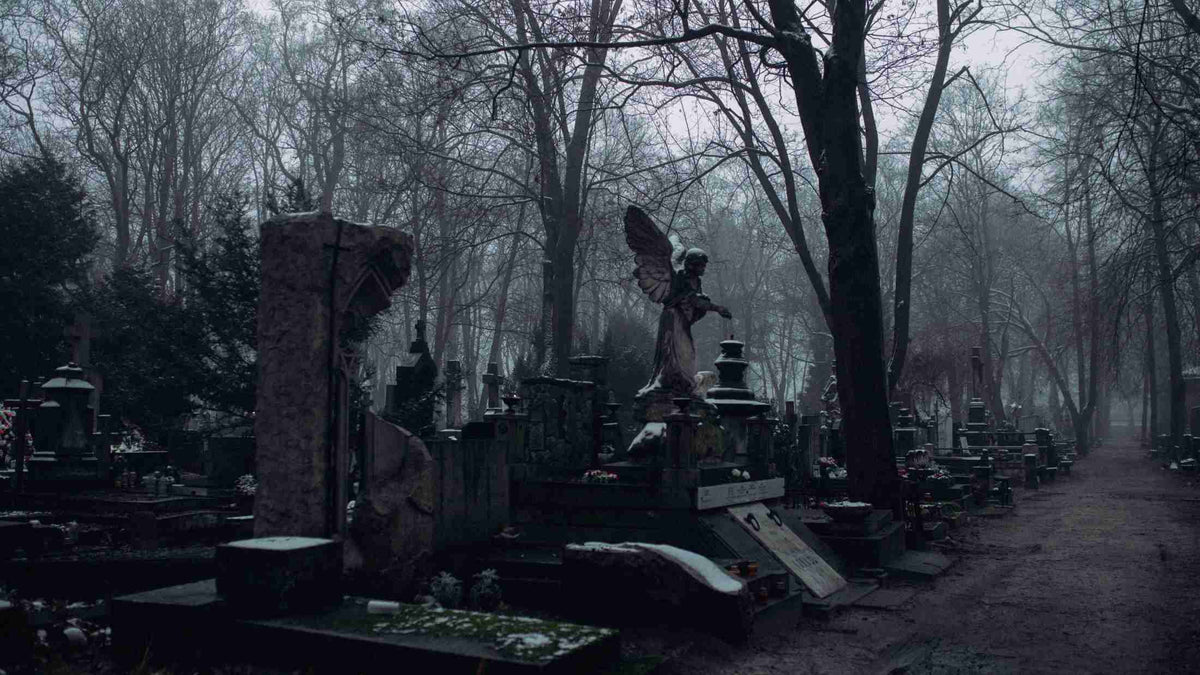 A dark Cemetery with an angle in the center.