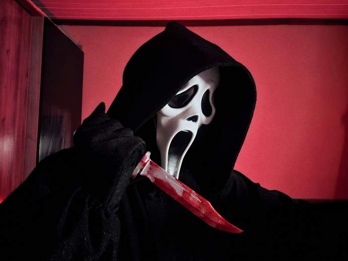 Ghostface with a bloody knife.