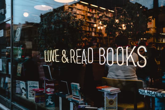 Dark romance bookshop storefront with the writing Love and Read Books.